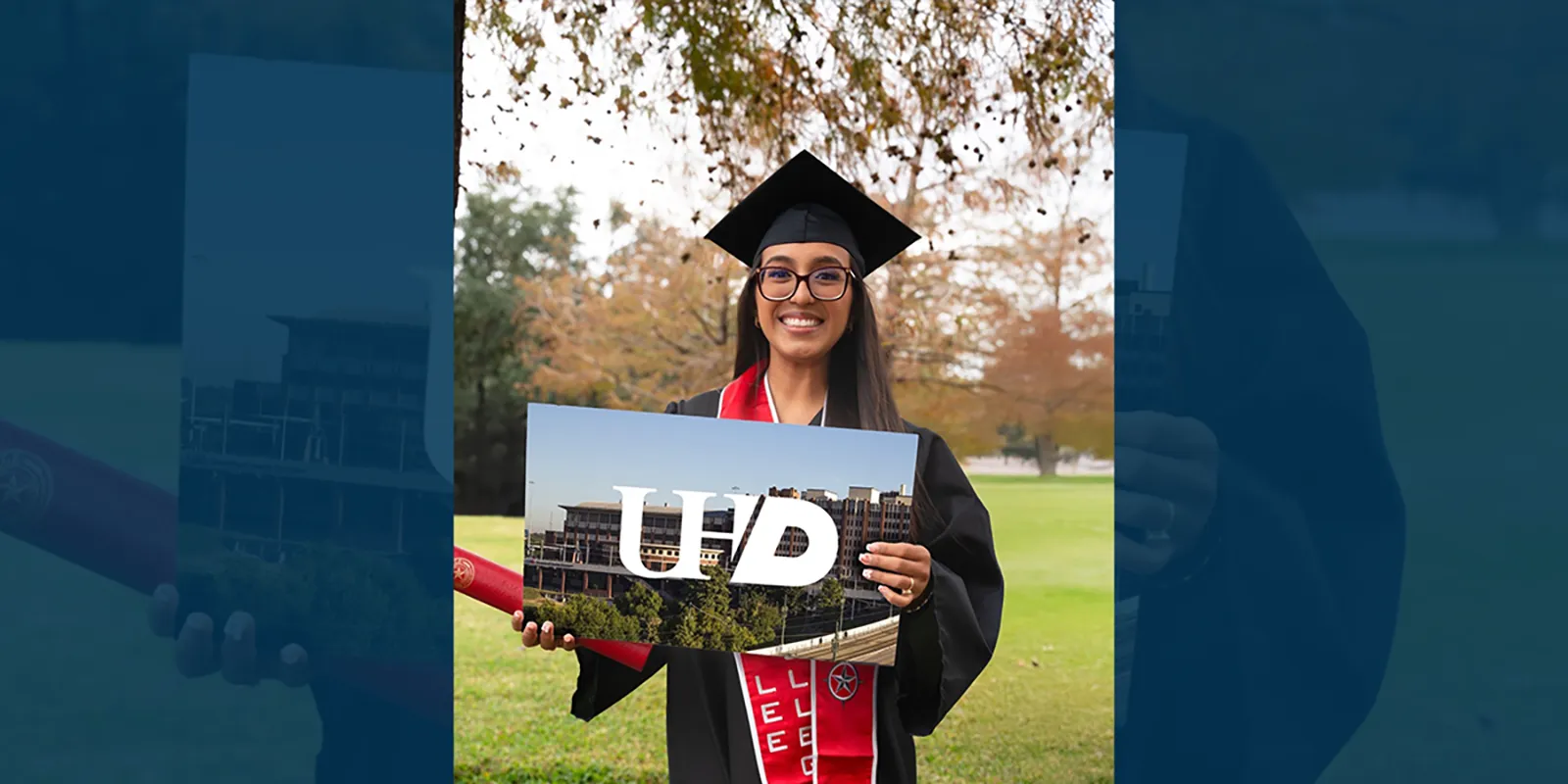 Graduate in a cap and gown holds a University of Houston sign, indicating where she will transfer after graduation.